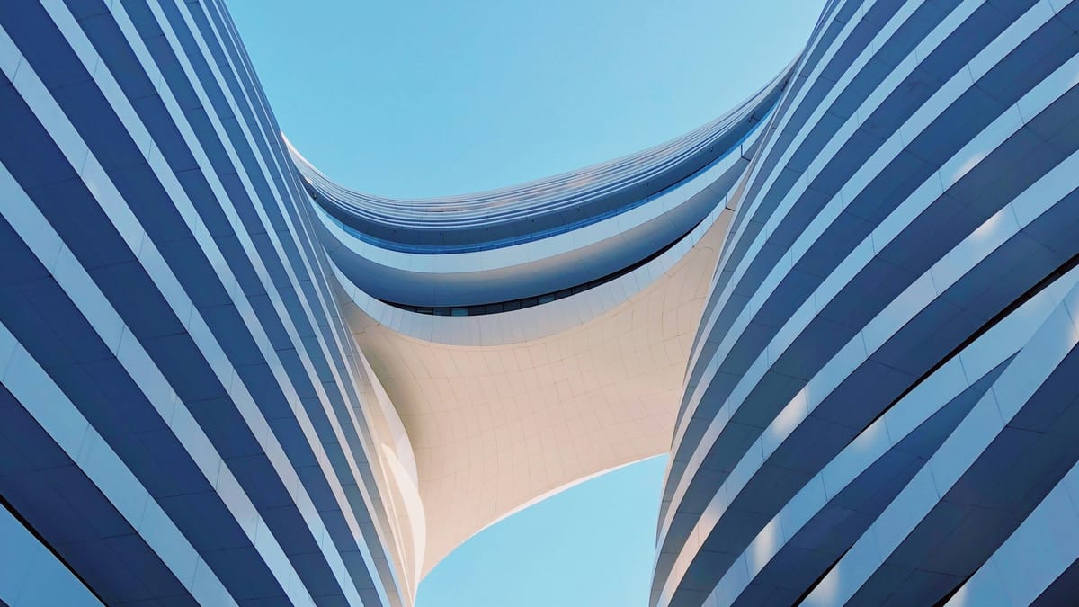 Photo of the Galaxy SOHO complex in Beijing, China by Jimmy Chang (@photohunter on Unsplash.com)